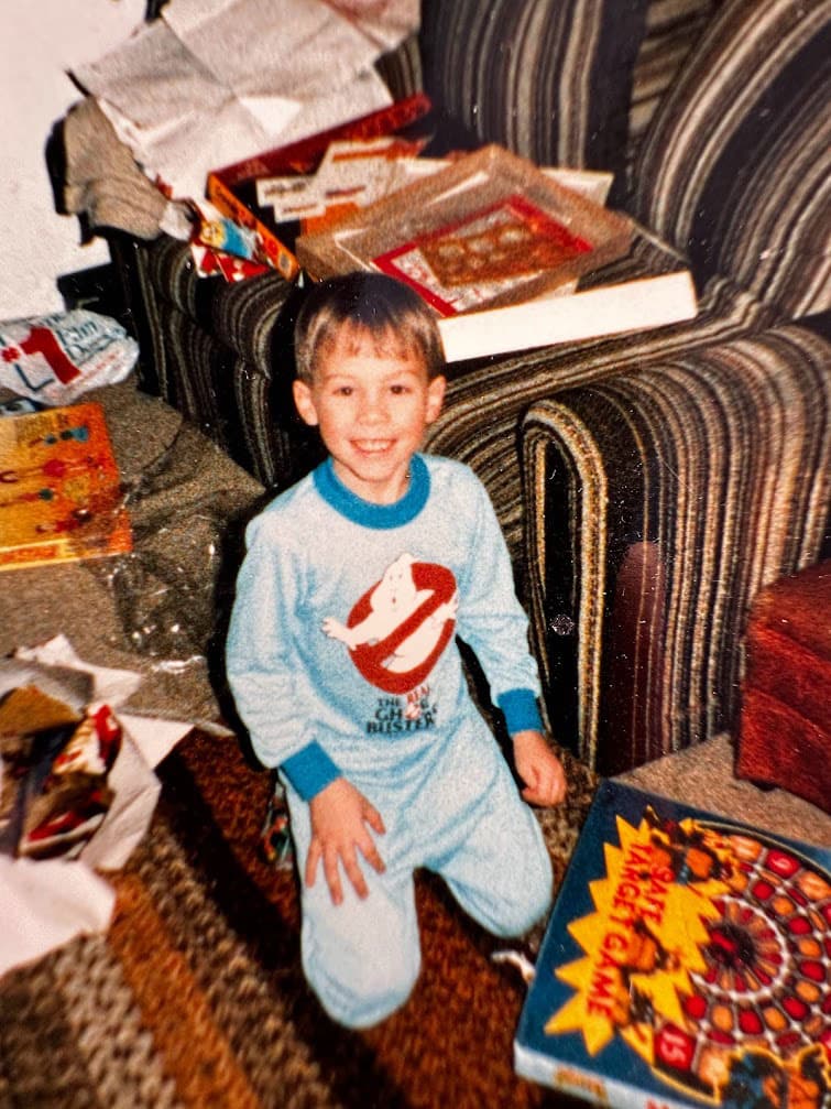 A young Schyler opening Christmas presents